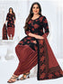 A woman wearing a Mahika Patiala Suit with a black and red floral print. The suit includes a dupatta and patiala pant.